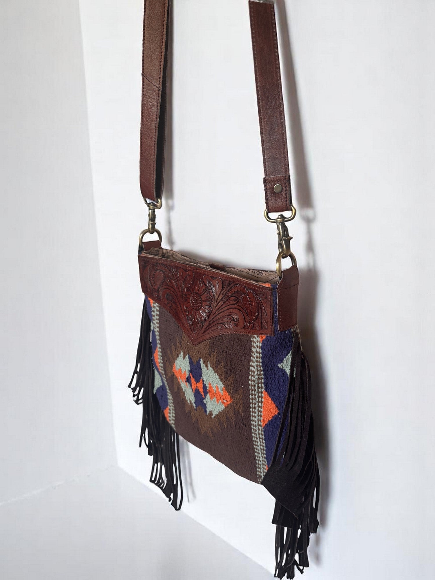 Crossbody Bag with Hand Tooled Patch and Fringes. 5399