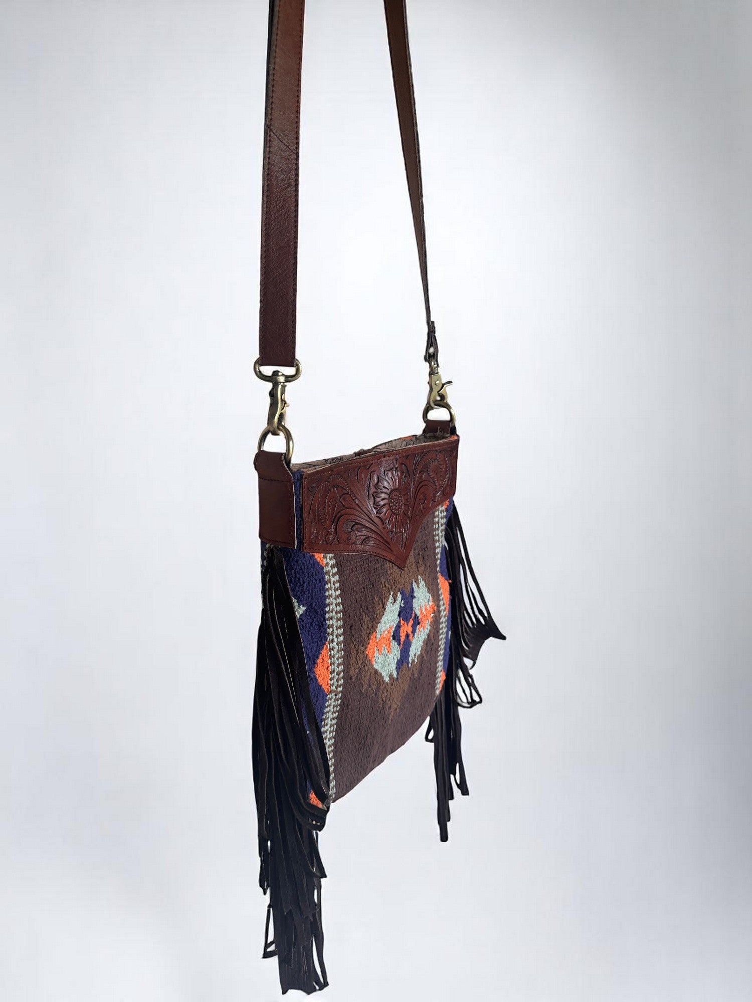 Crossbody Bag with Hand Tooled Patch and Fringes. 5399
